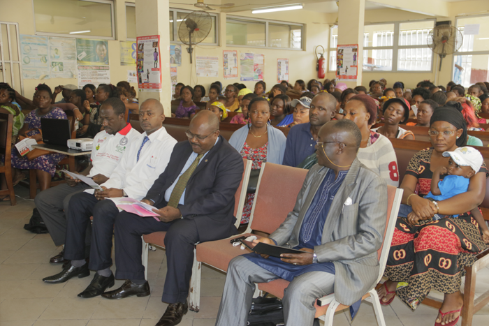Cross section of officals and the audience listening to presentations