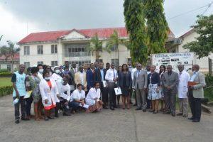 CDC Director and team pose with Care and treatment Centre staff of Buea Regional Hospital