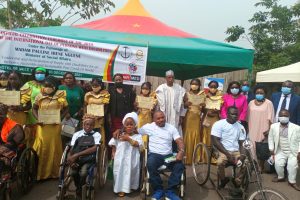 Stakeholders poses with Persons with disabilities