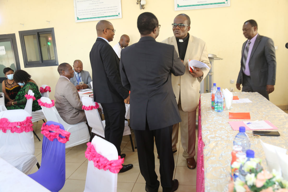 The Executive President Rev Dr Nditemeh shakes hands with the newly elected after his final pronouncement