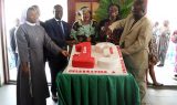 CBC Executive President cutting the cake to mark 13-Year Partnership with CBM Australia