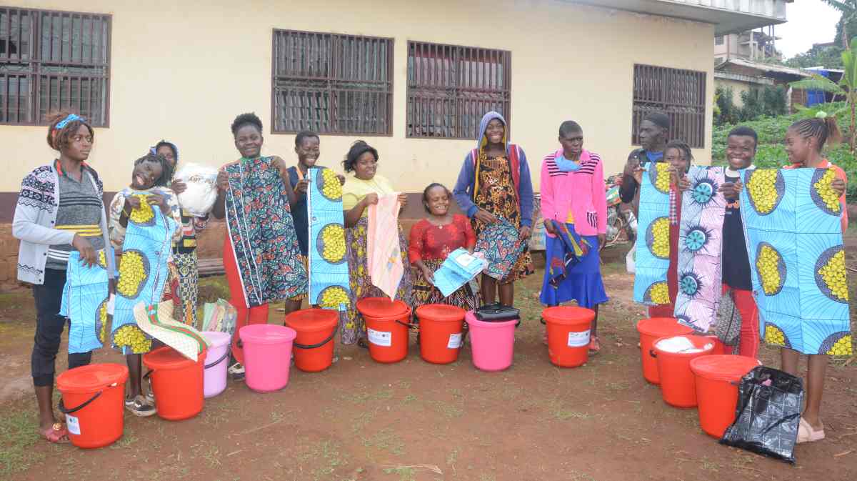 Women with disabilities brandish DIHA donated Dignity and Mama kits