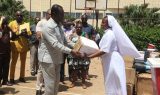 Administrator of SAJOCA Bafut receiving the donation