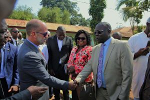 Firm handshake with Dr. Kum, HIVF Manager for West region