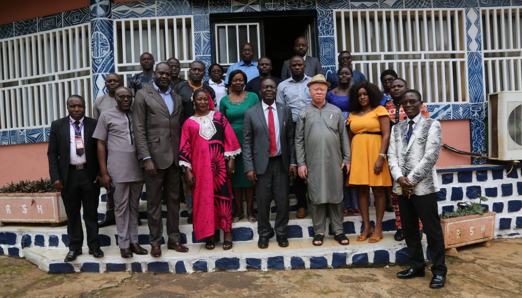 Stakeholders pose in support of services to persons with disabilities in West region-min