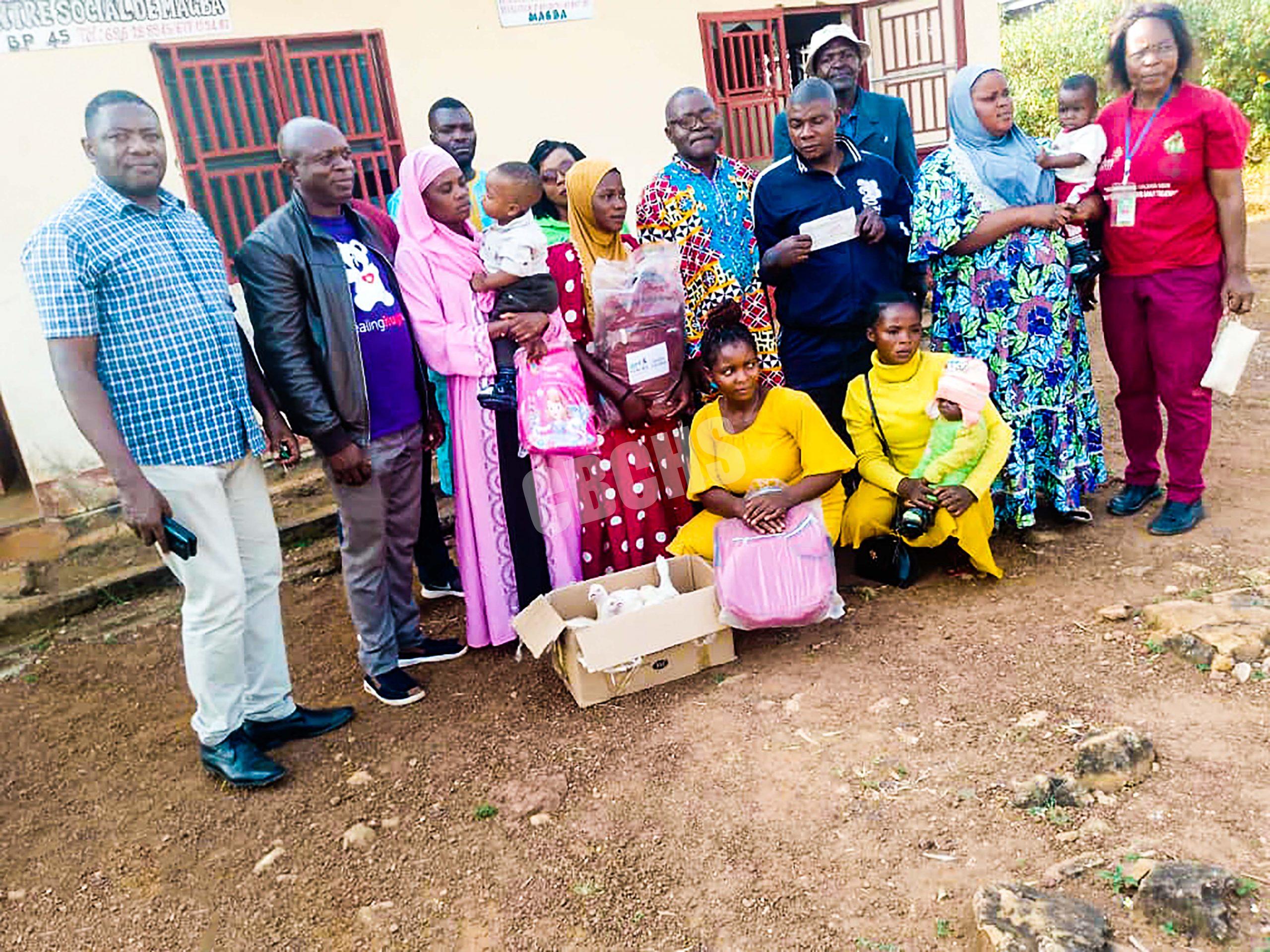 Beneficiaries pose with officials