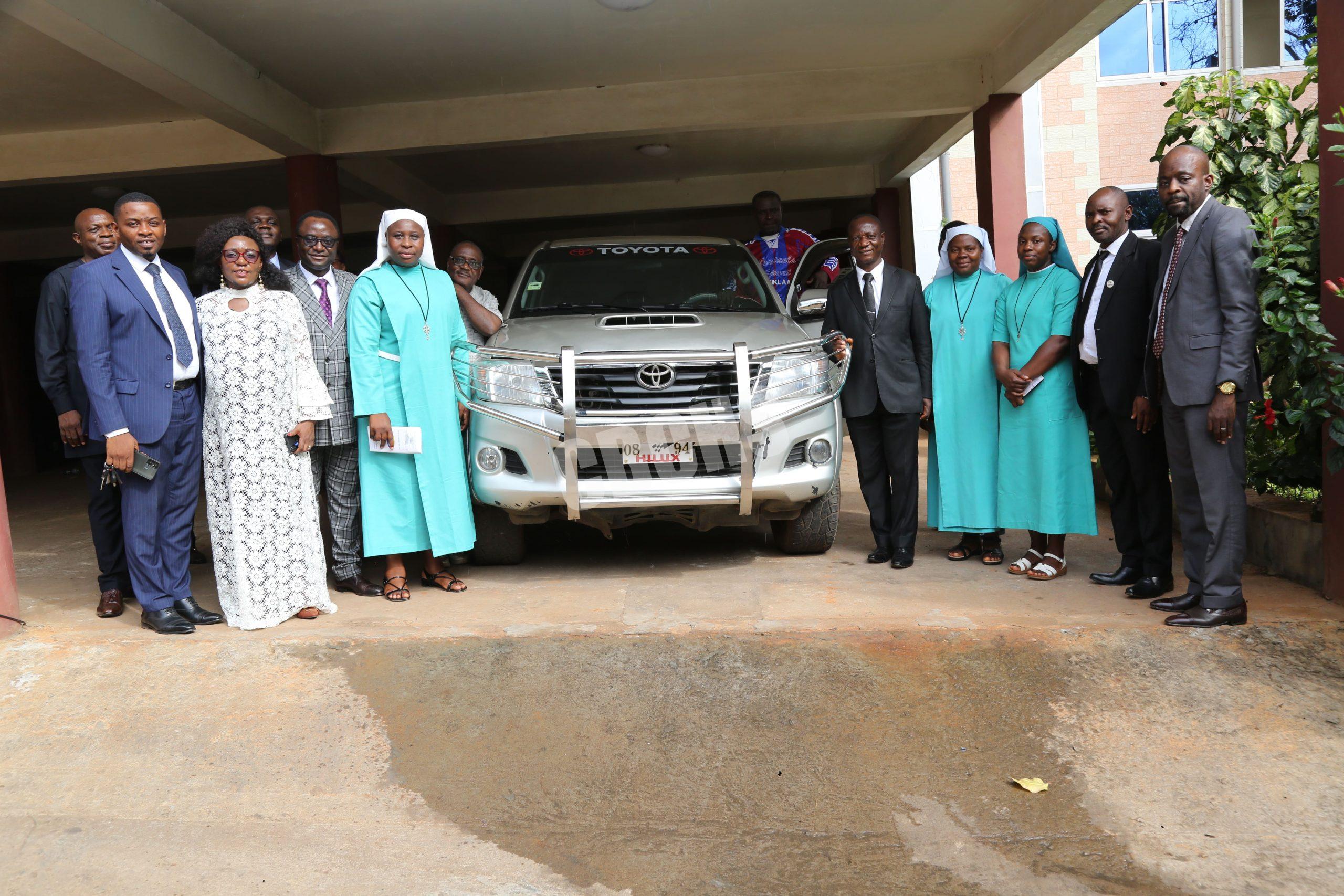 Family photo of Emmanuel Sisters and Leaders of the CBCHS with newly offered vehicle