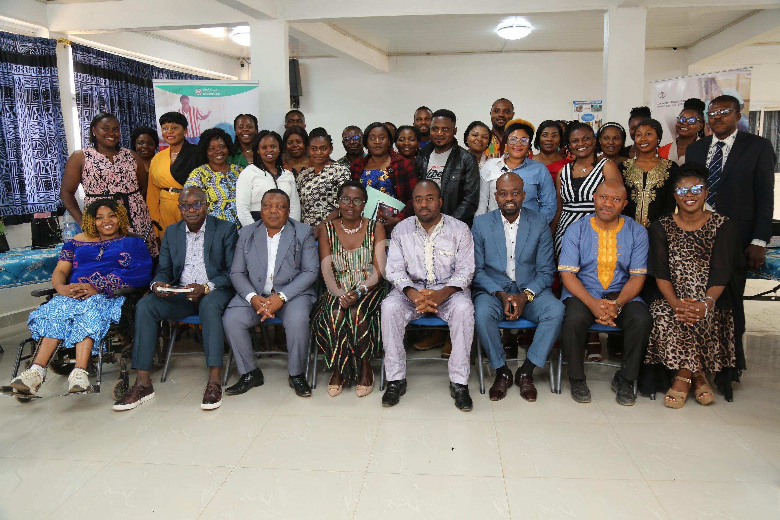 Stakeholders and contributors stand united as they celebrate the successful creation of the manual