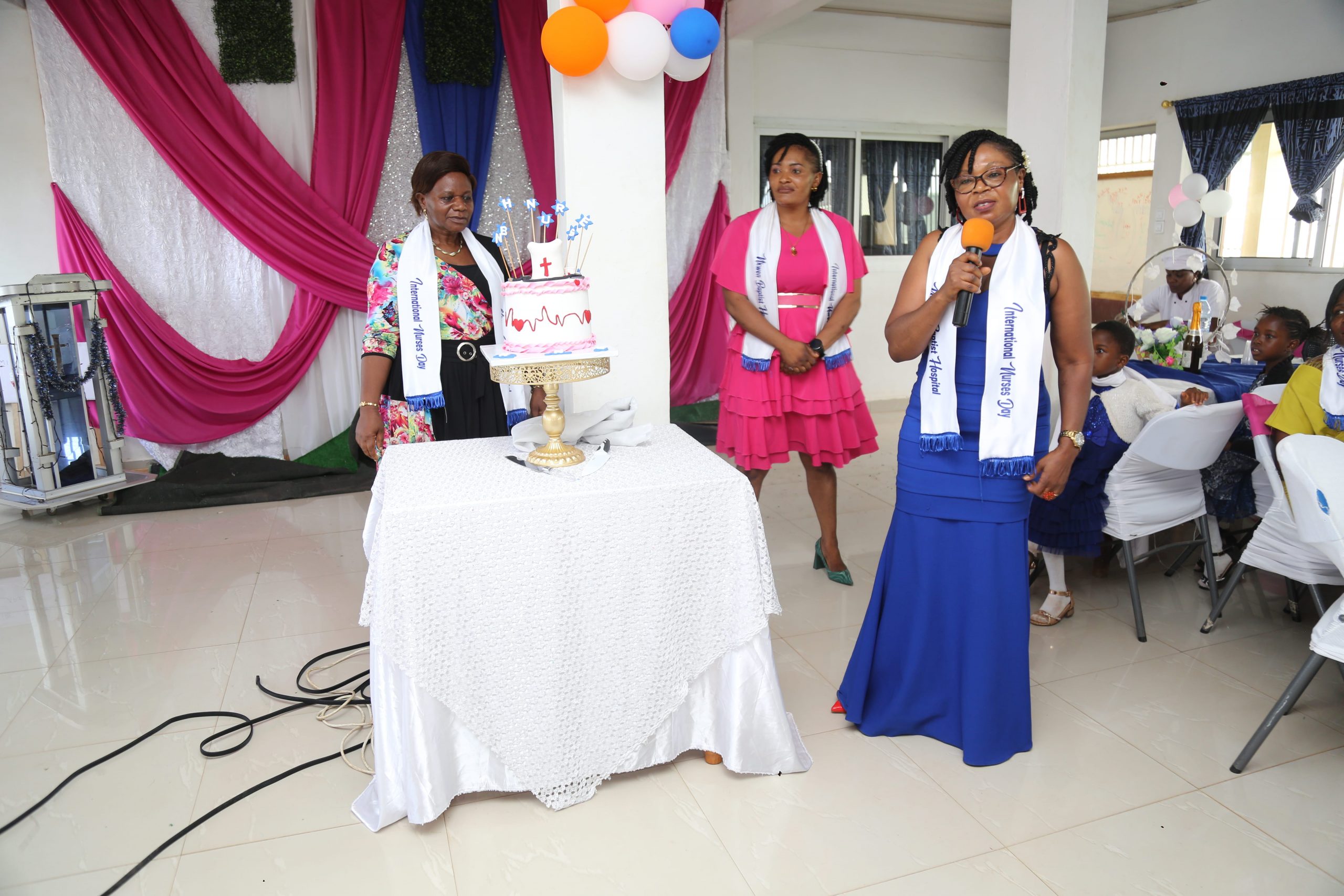 Mrs. Nana officiating the Cake Ceremony