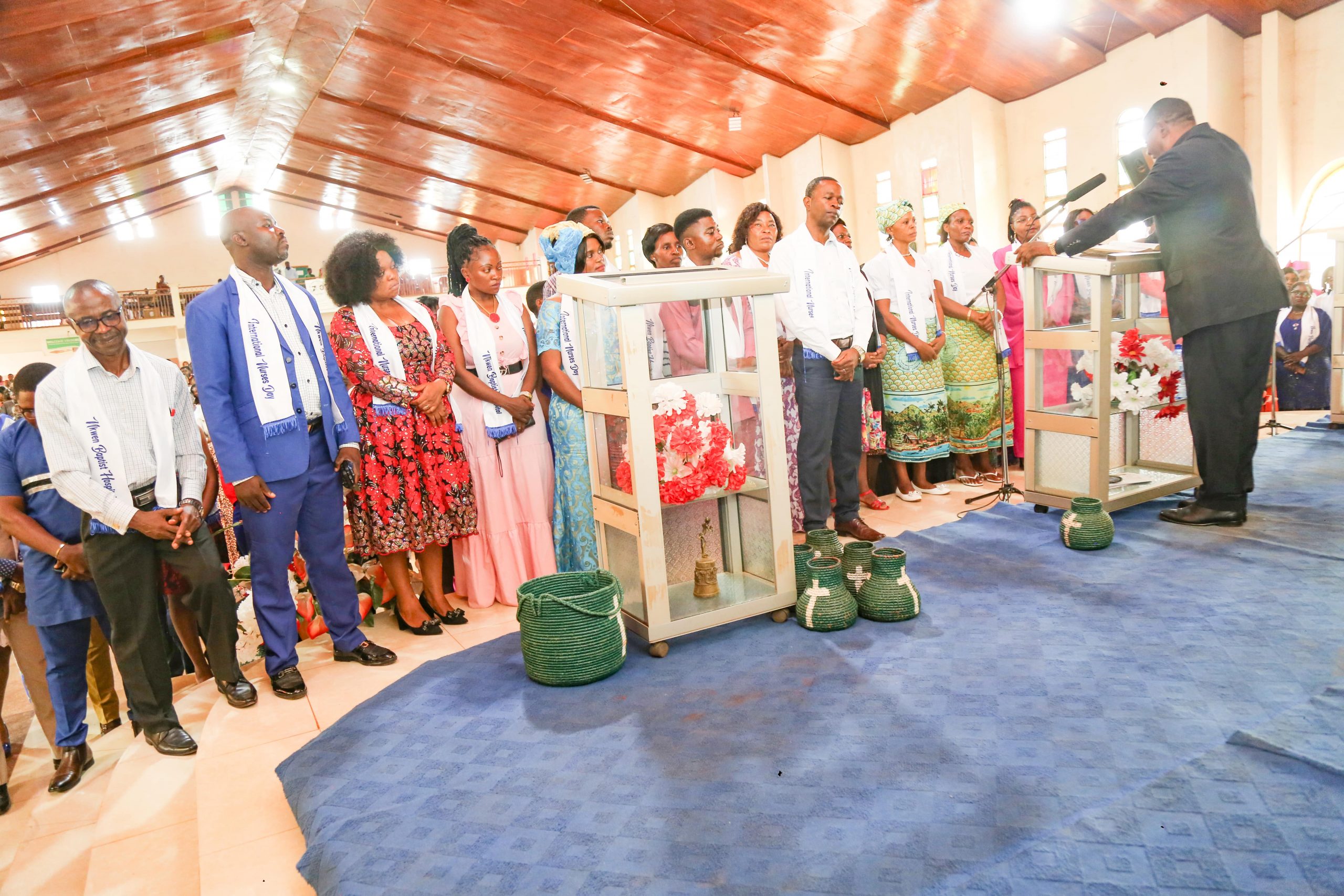 Rev. Njini prays, dedicates nurses and their uniforms to God