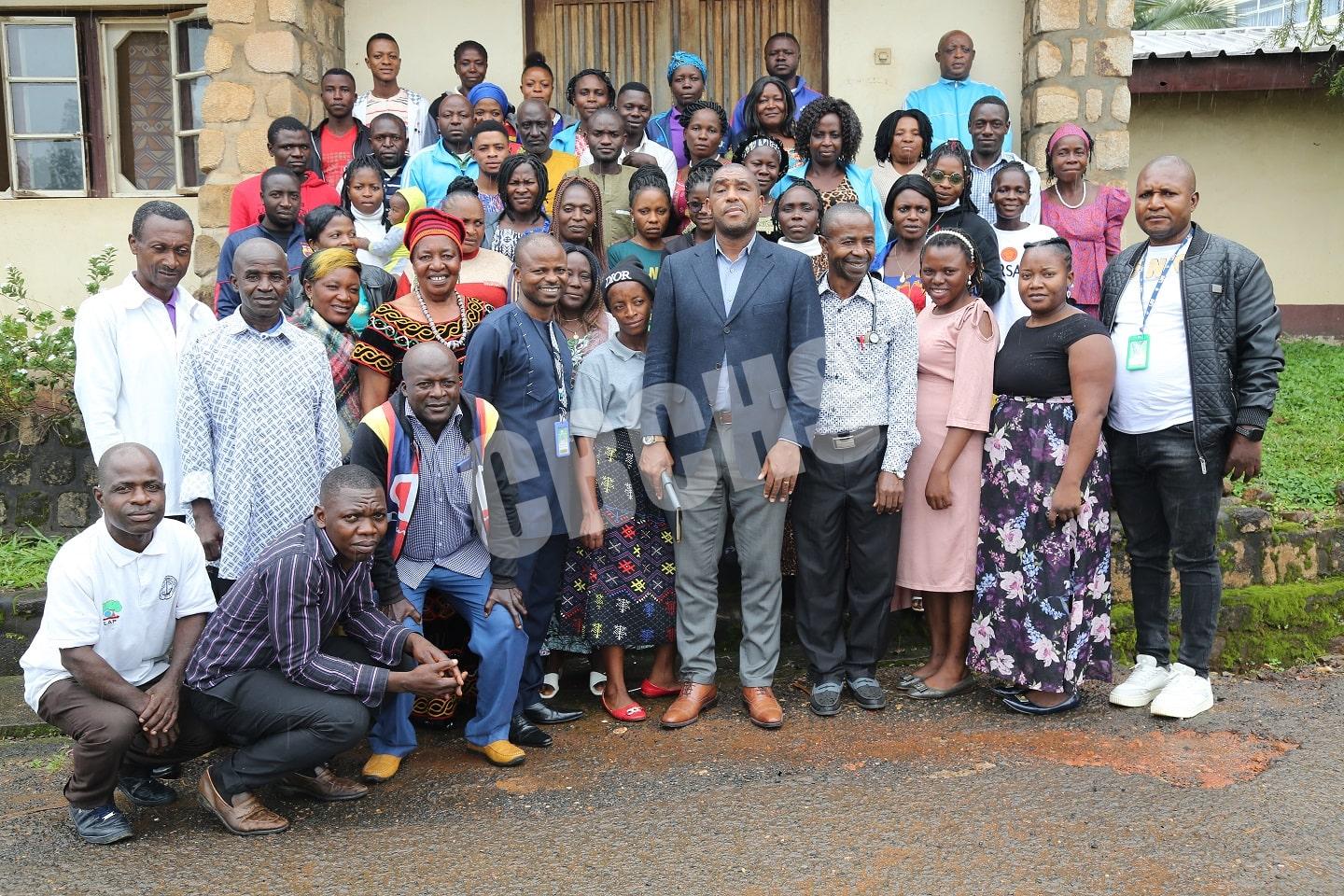 Village Health Workers pose with Director of Health Services