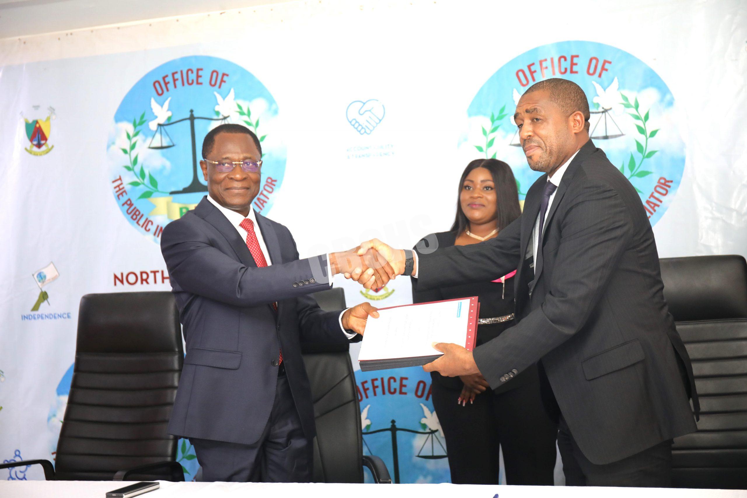 Tamfu Fai & Ngum Samuel exchanging signed MoU