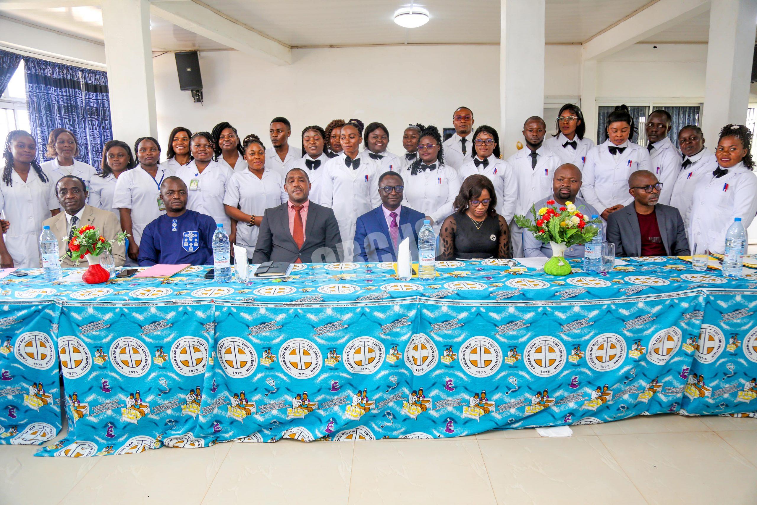 Graduates of the twin courses pose with the Administration