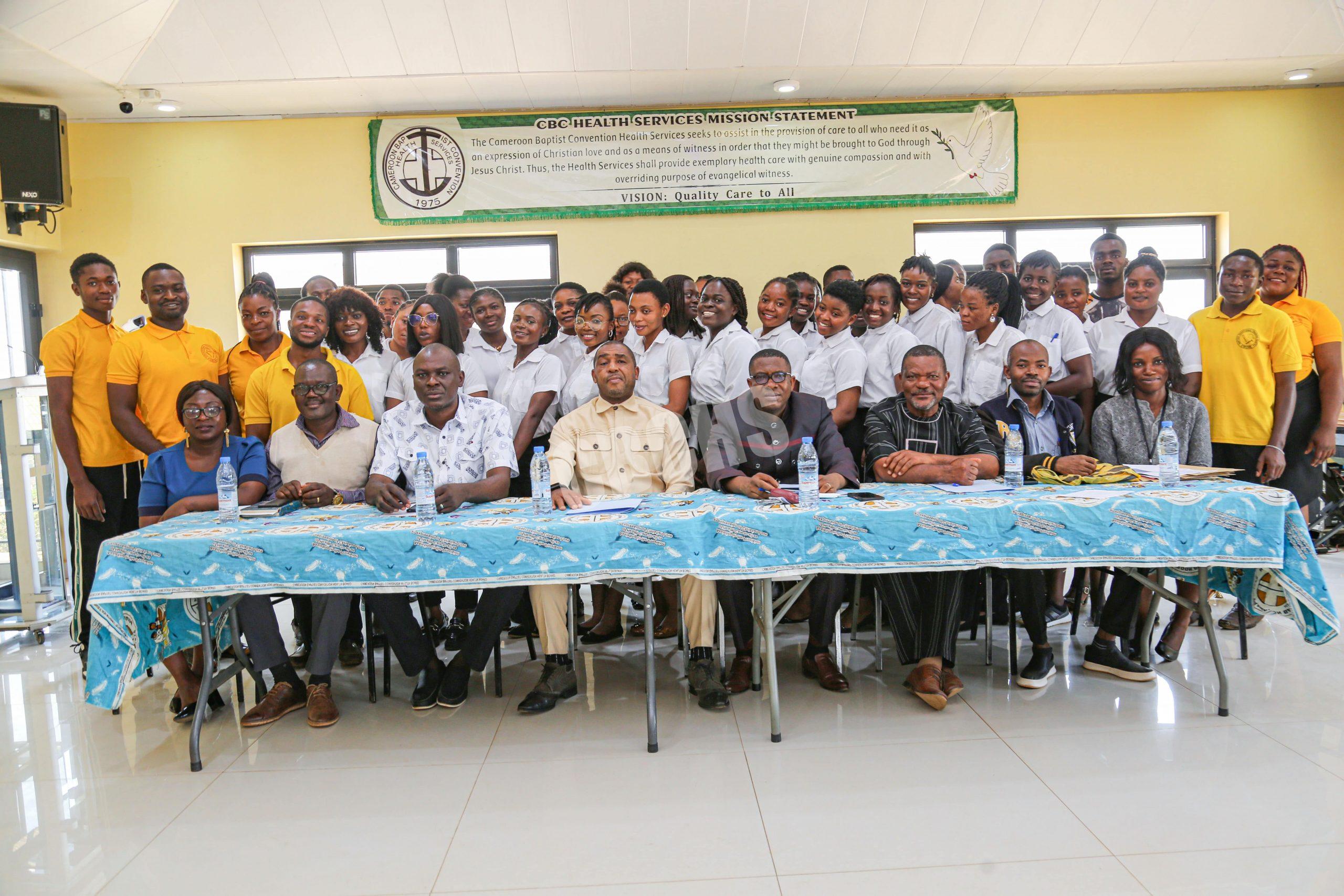 DHS & officials pose with grduands