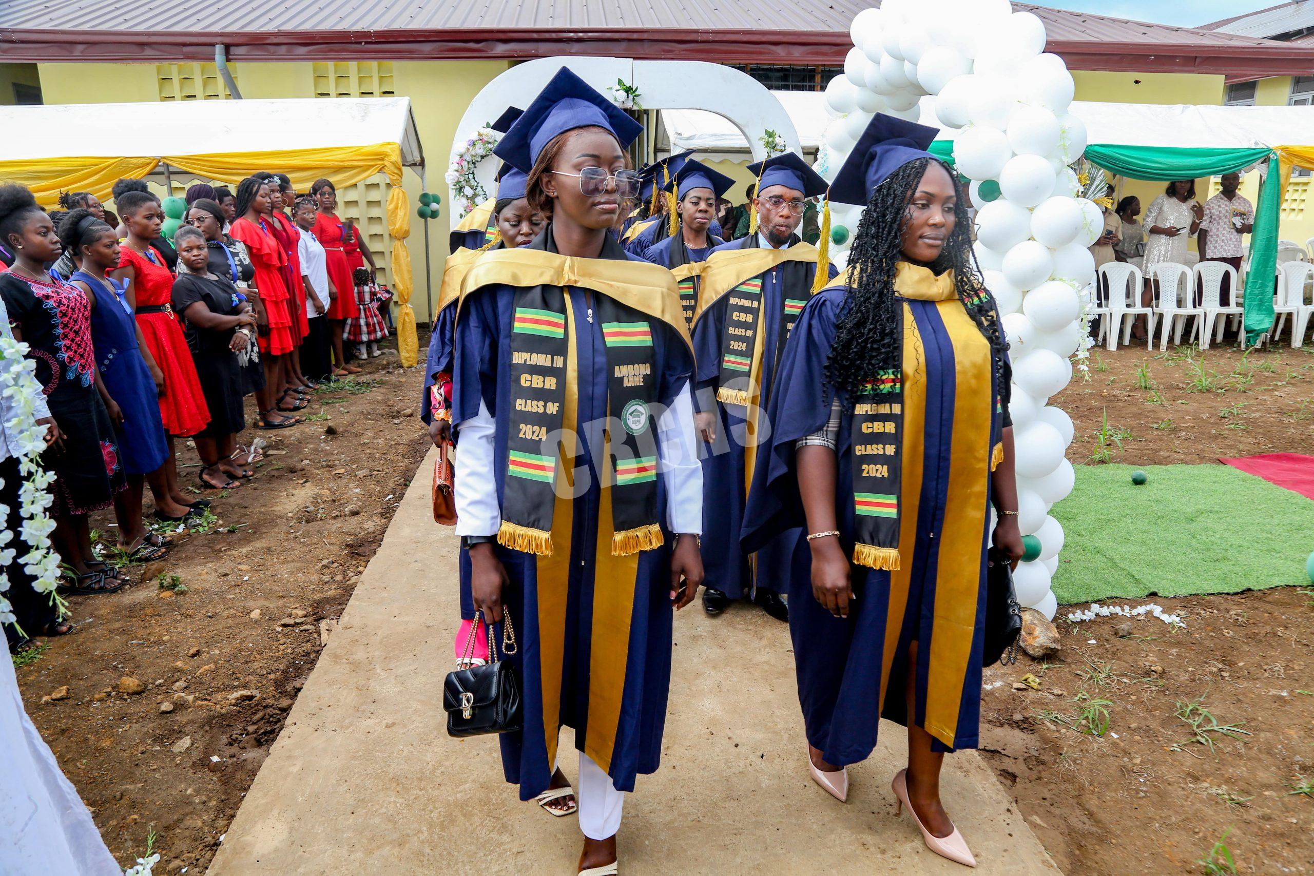 Graduands marching in to the pomp and circumstance