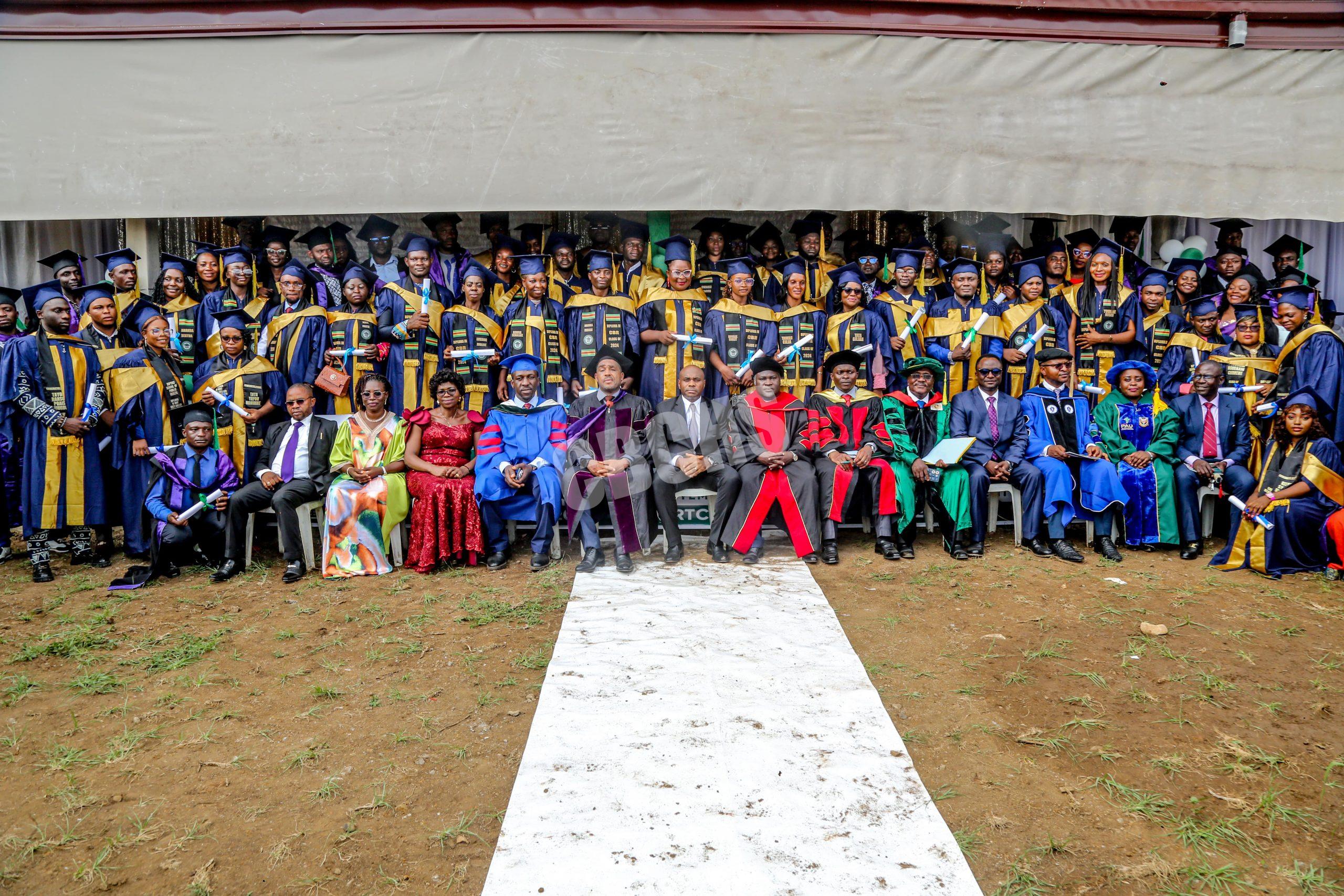 Graduates & officials pose to immortalize the event