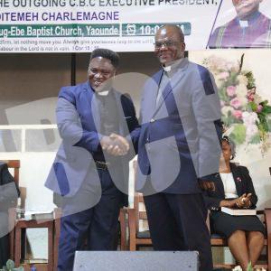 Incoming EP, Rev. Dr. Teke John (left) congratulating the outgoing EP for a job well done