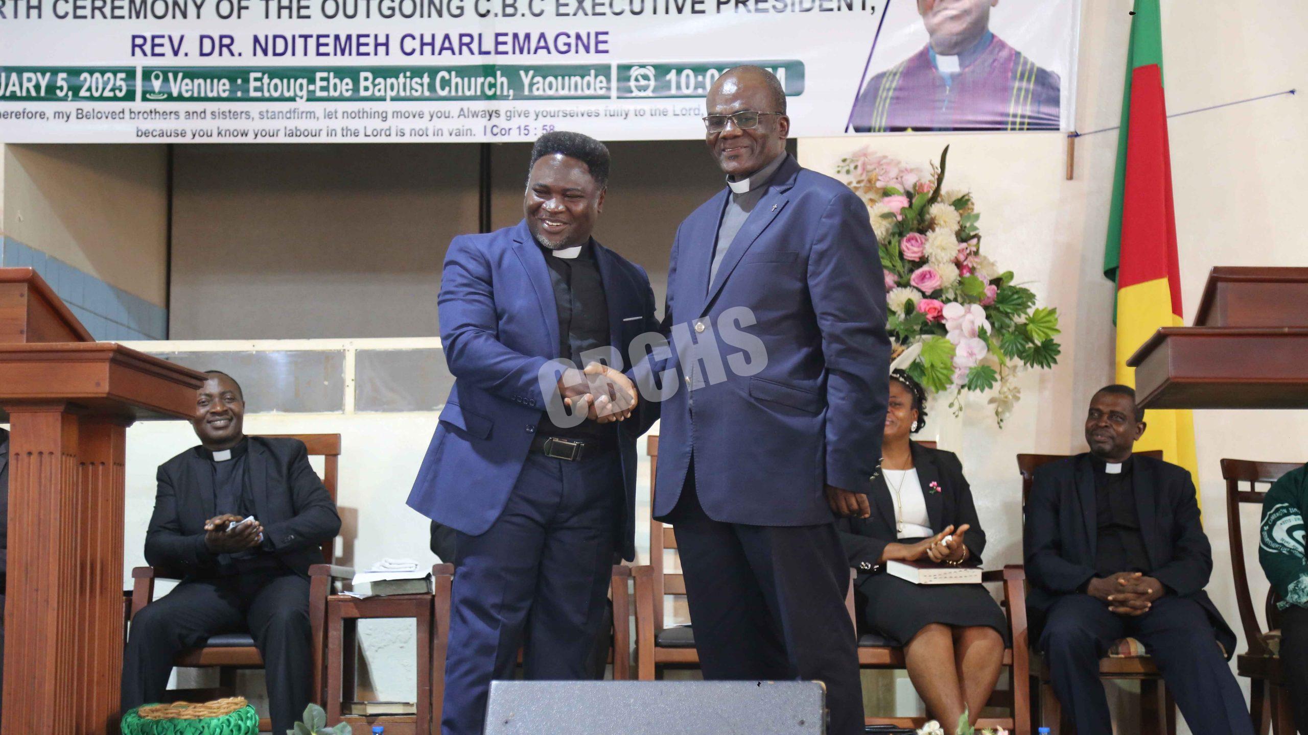 Incoming EP, Rev. Dr. Teke John (left) congratulating the outgoing EP for a job well done