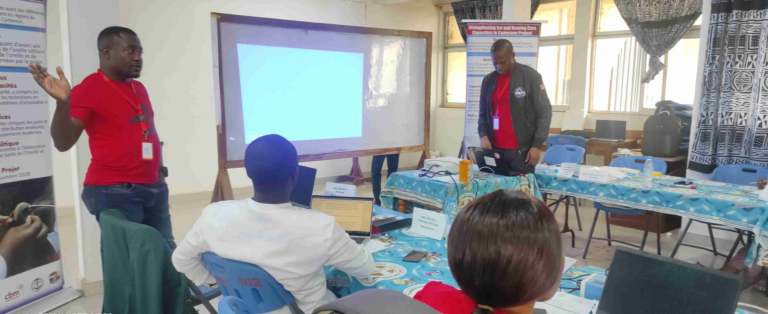 IEH Program Officer imploring staff to work with the community