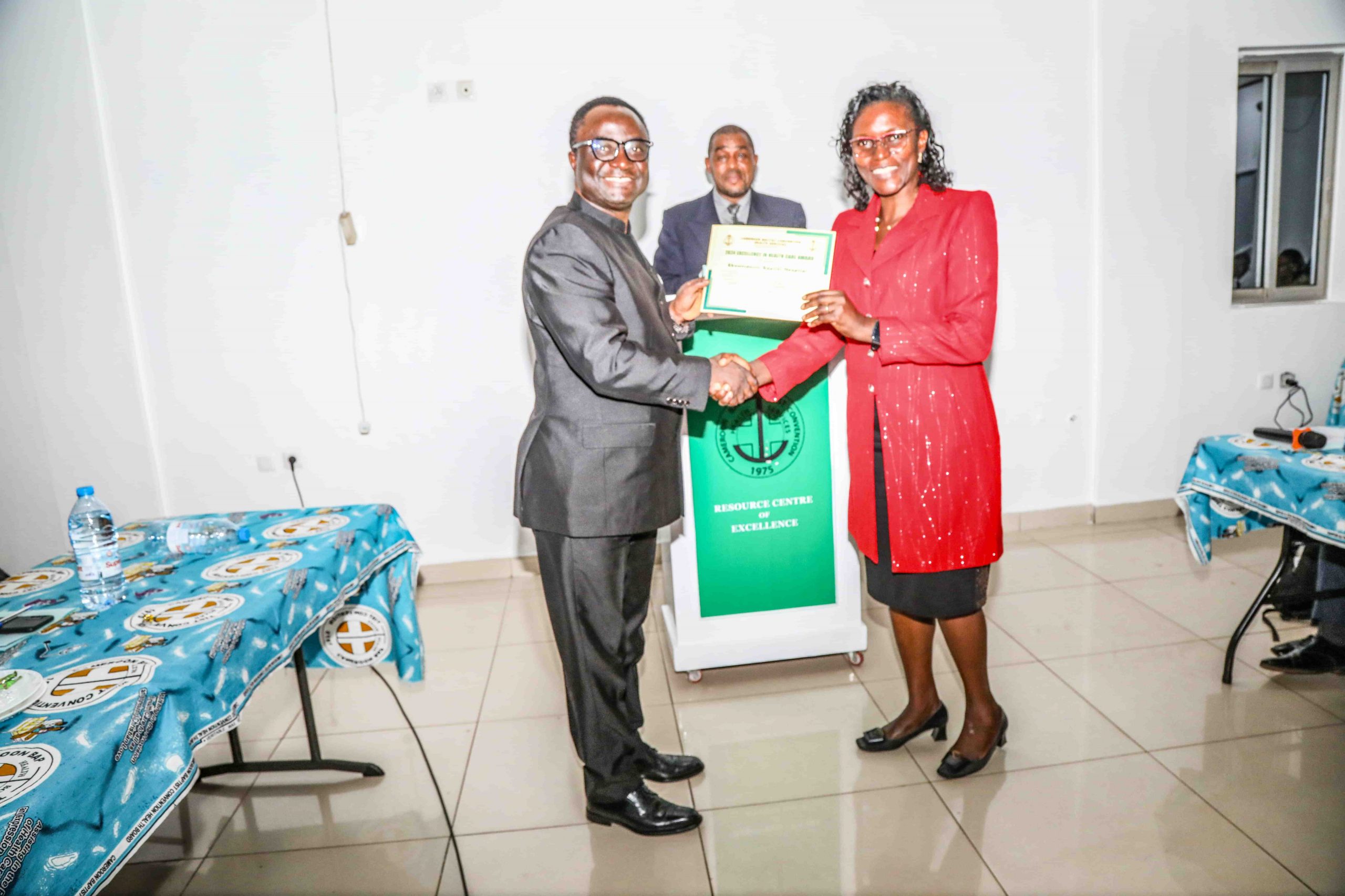 The SNS of Ekoumndoum Baptist Hospital (right) receiving an award