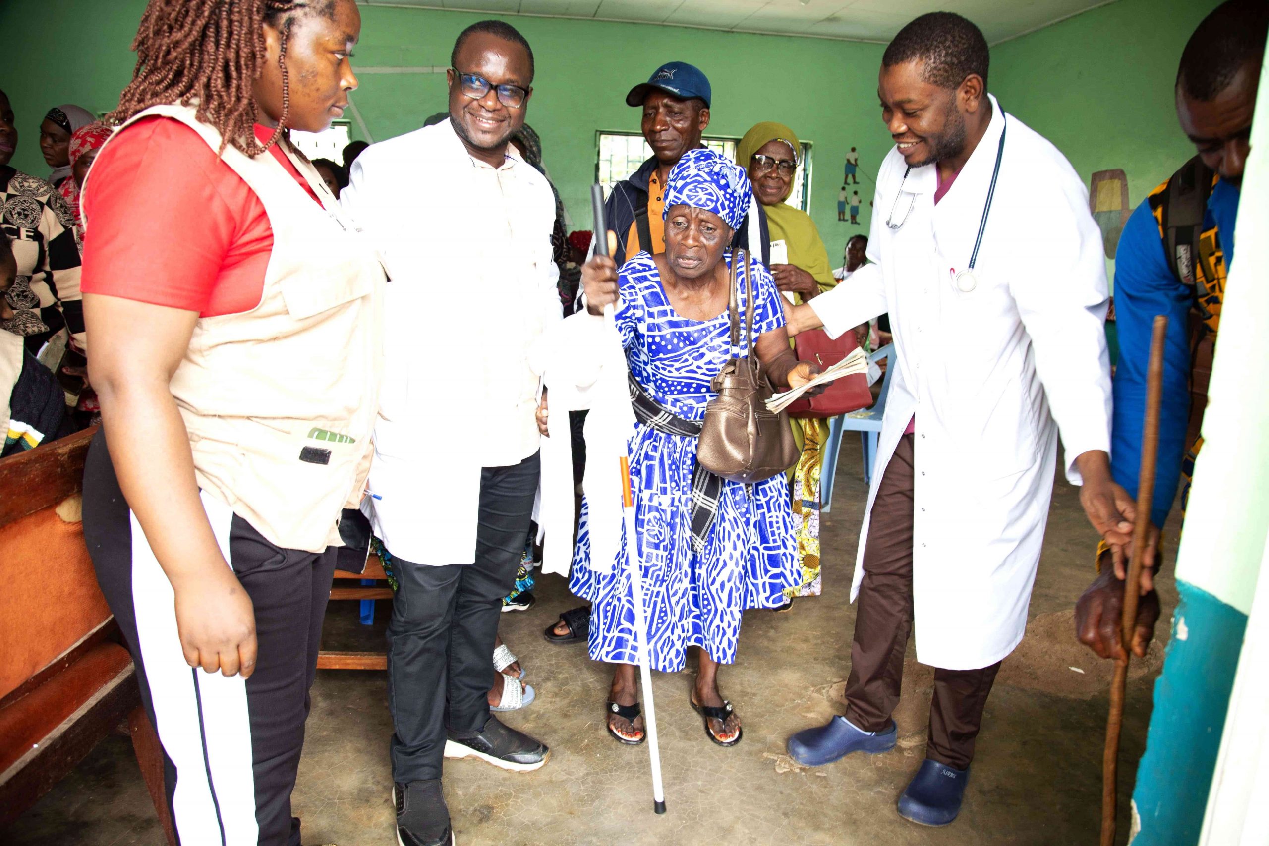 Mama Esther Receives Whitecane for mobility assistance