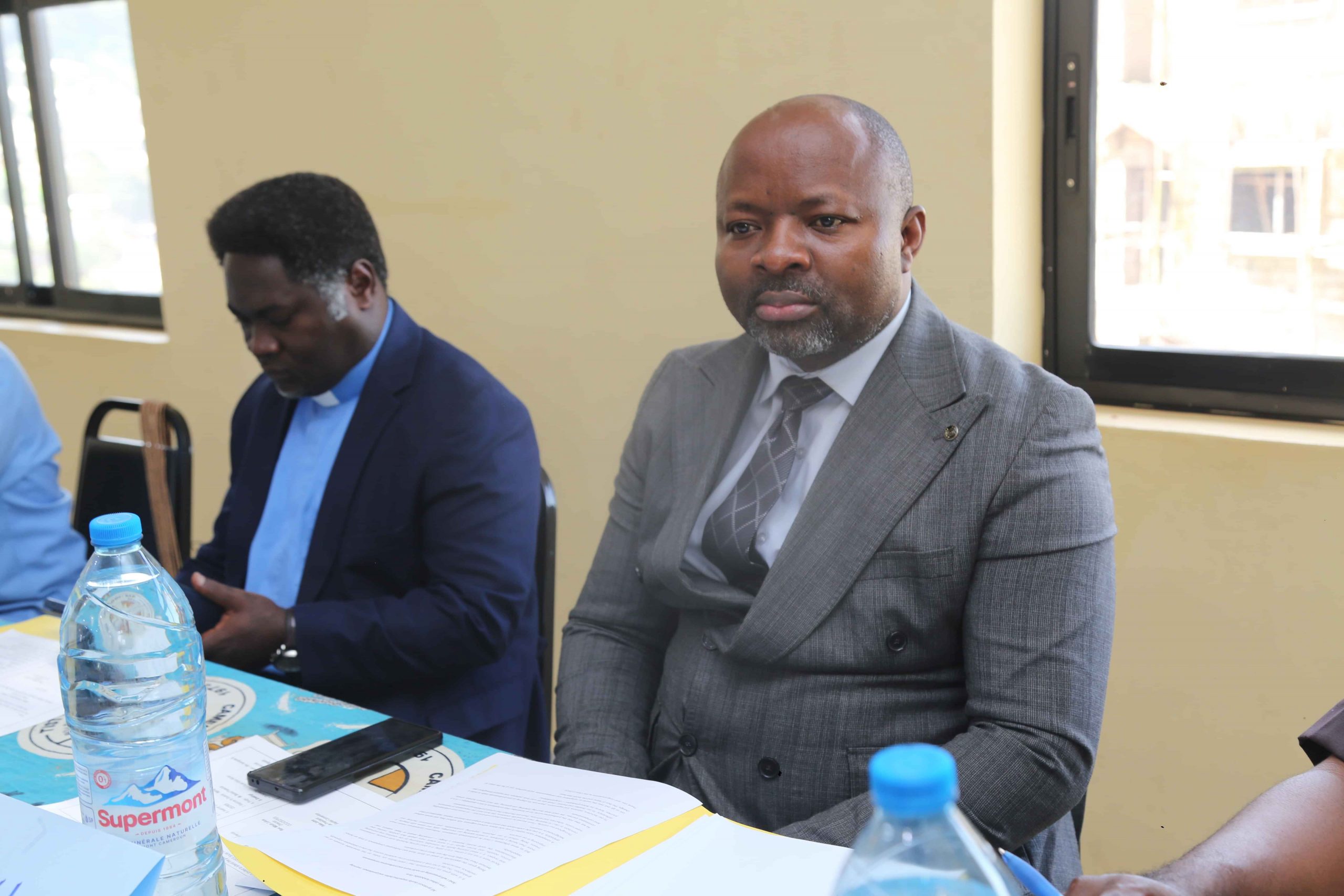 CBCHS Personnel Manager, Mr. Ndosak George sitting next to the Executive President, Rev. Dr. Teke John