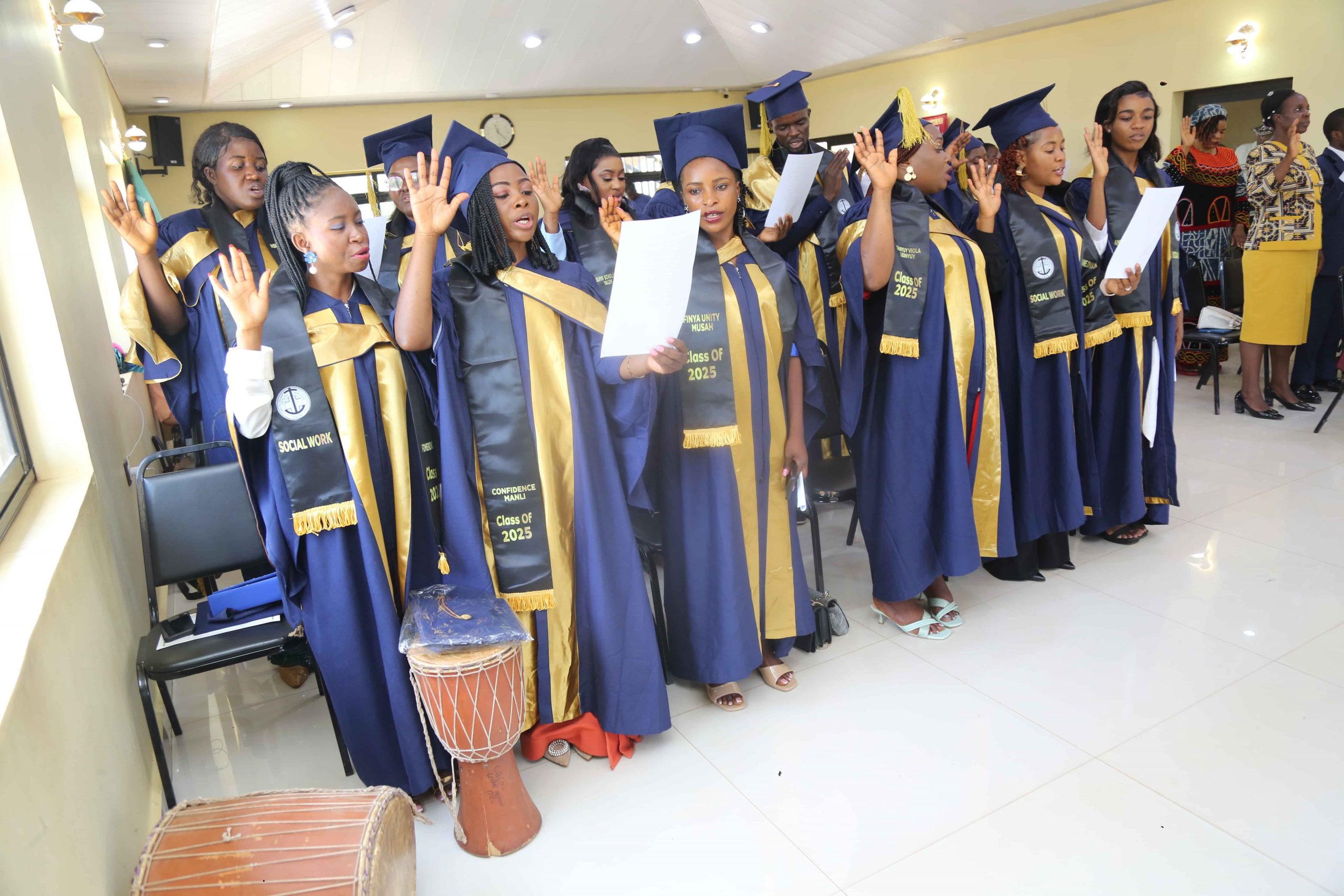 Graduating social workers taking the oath os confidentiality in their practice
