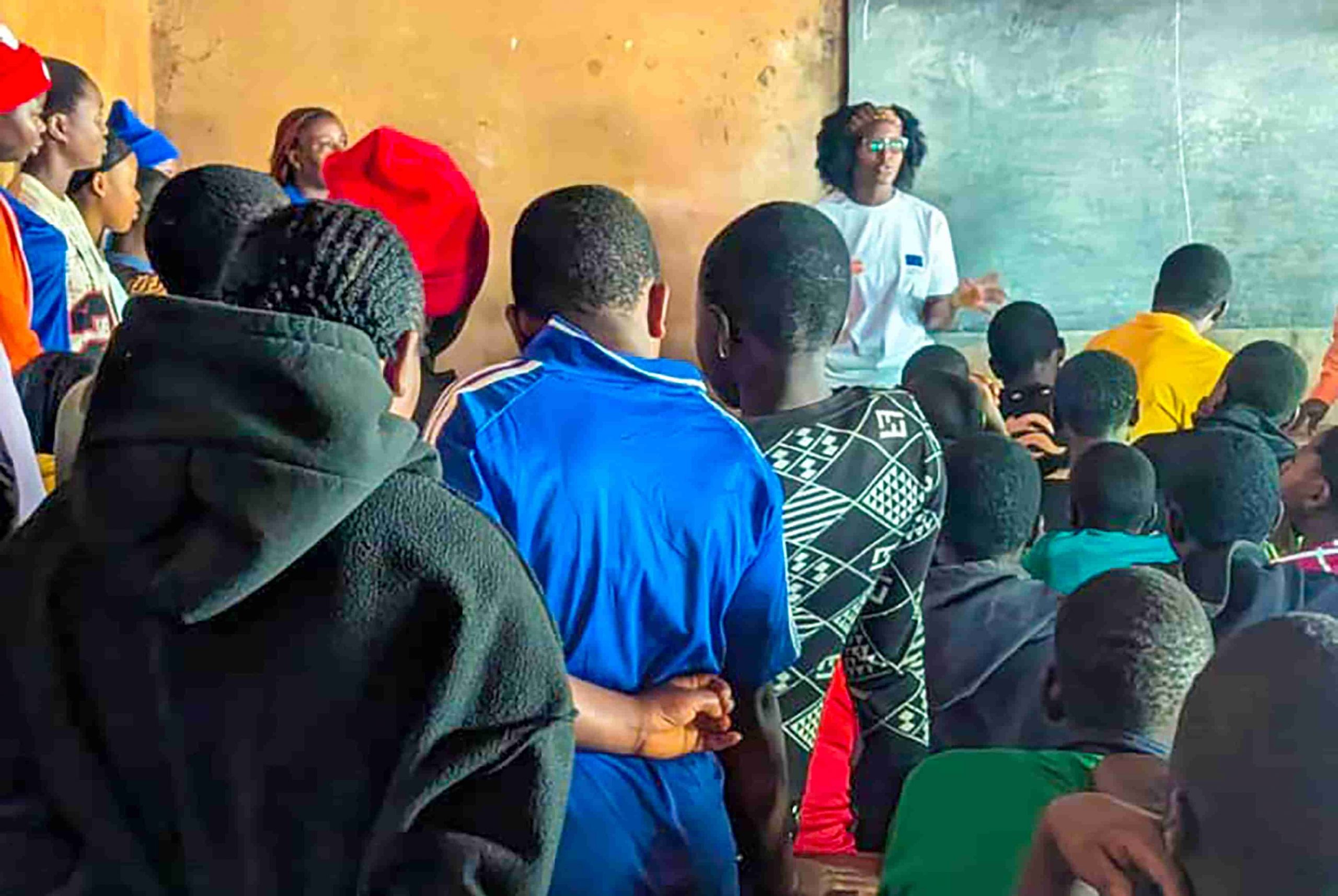 A Youth Peer Educator drills secondary students on SRH and GBV during an outreach in Finkwi