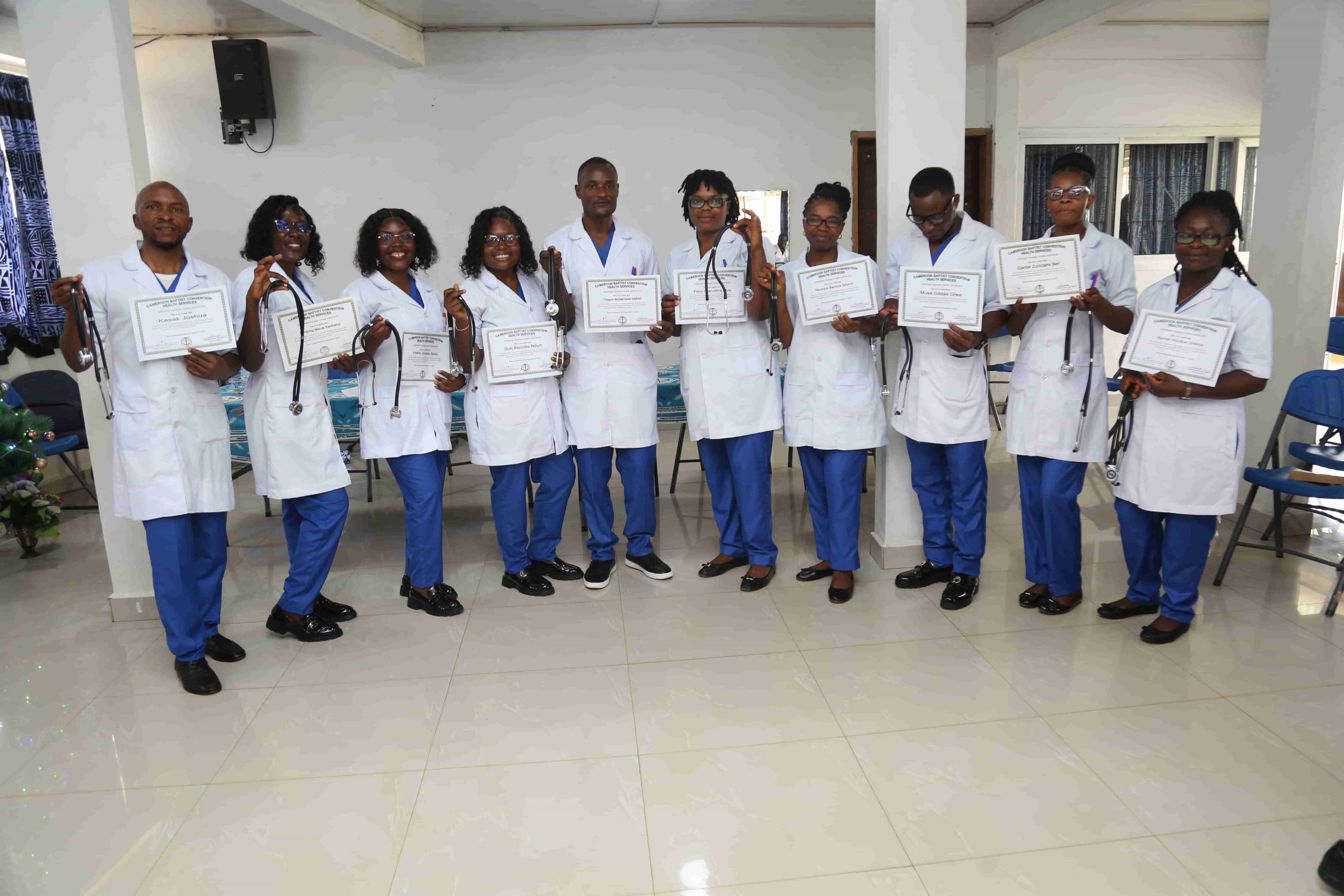 Newly graduated screeners pose with certificates