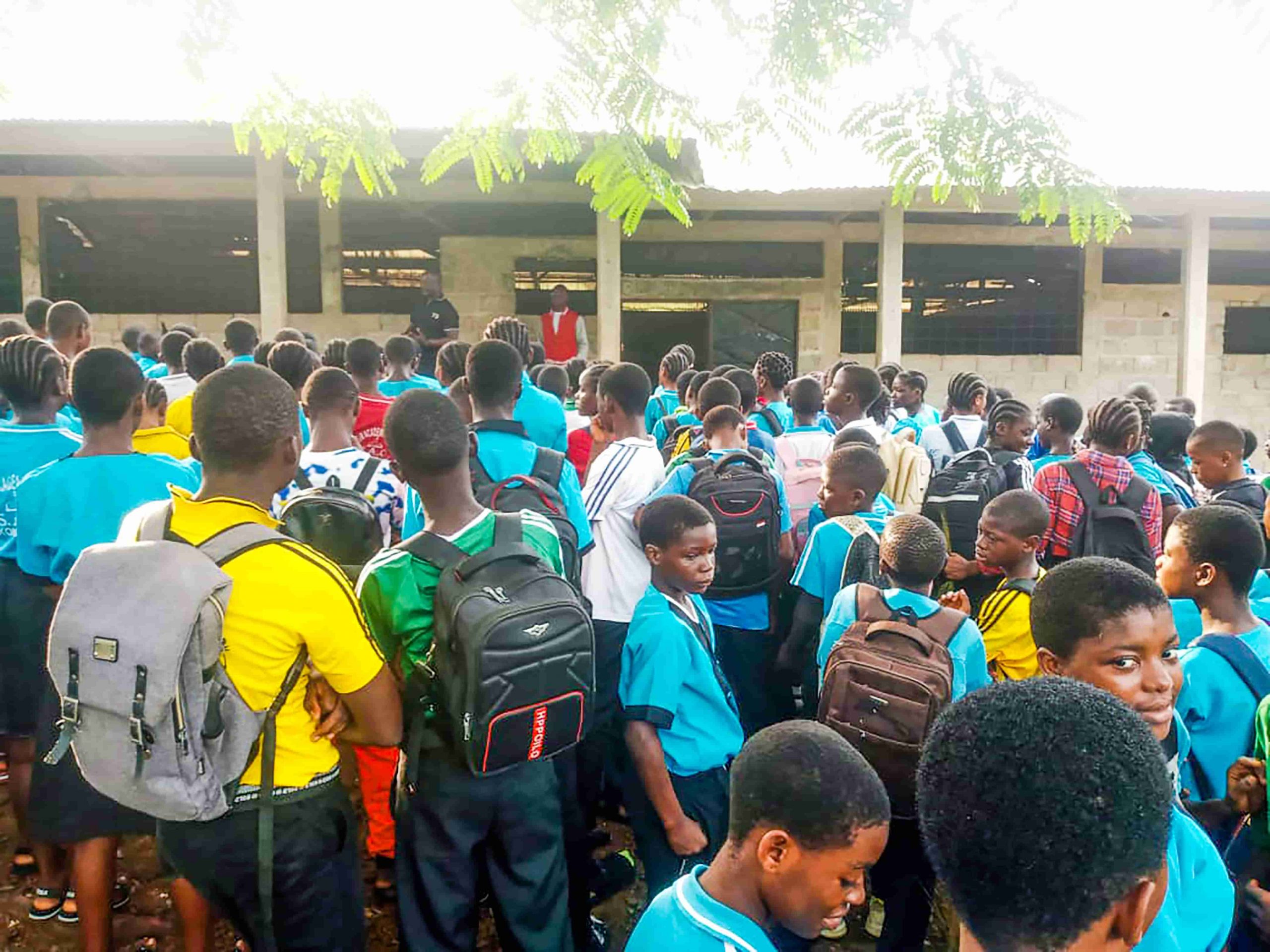 School Children in Ekondo Titi listens to talks from Youth Peer Educator, Amino Ephily