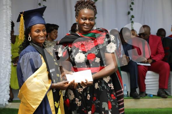 Dr. Ndi Norah awwarding certificate to a graduand
