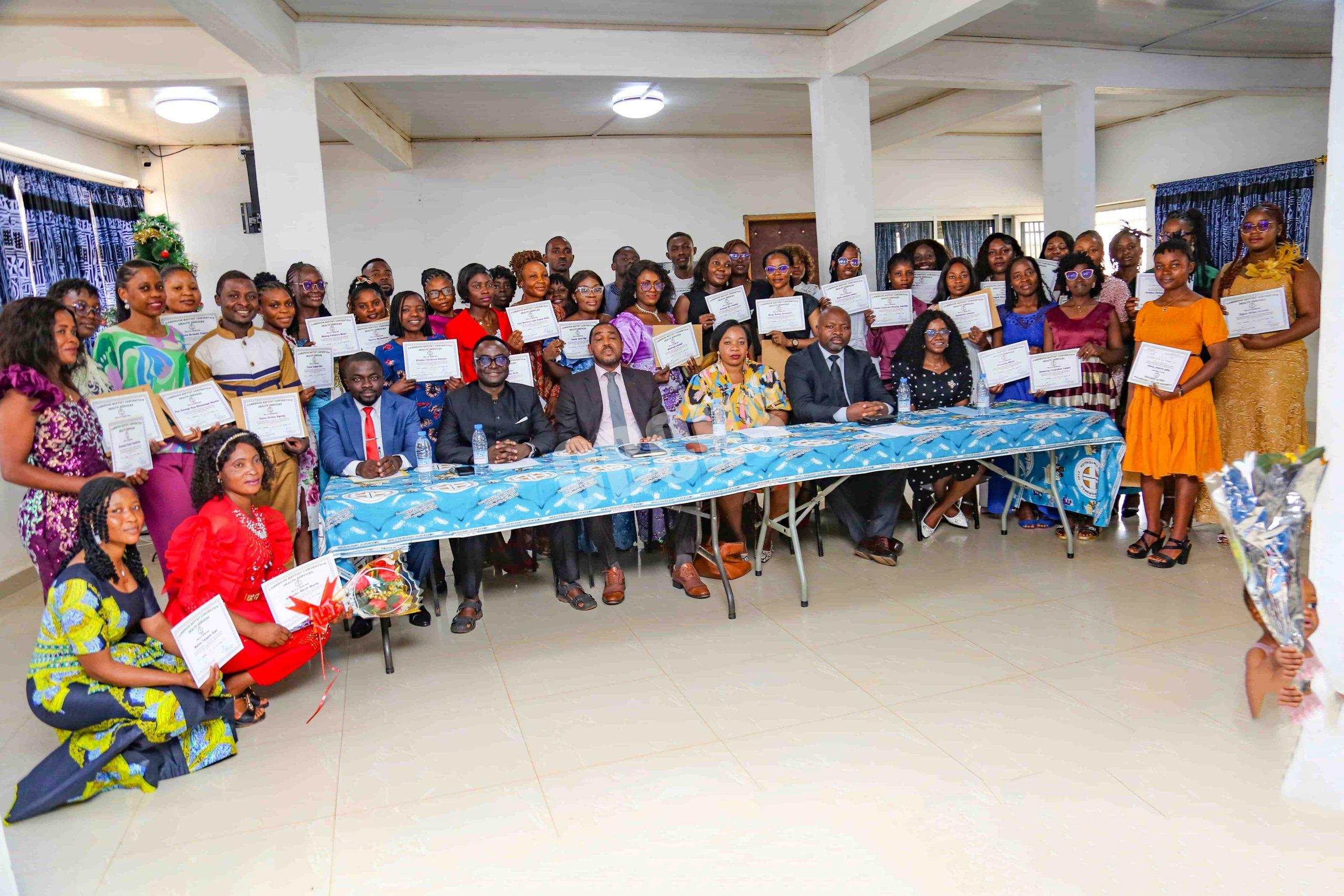 Graduating finance clerks pose with officials to immortalize the event