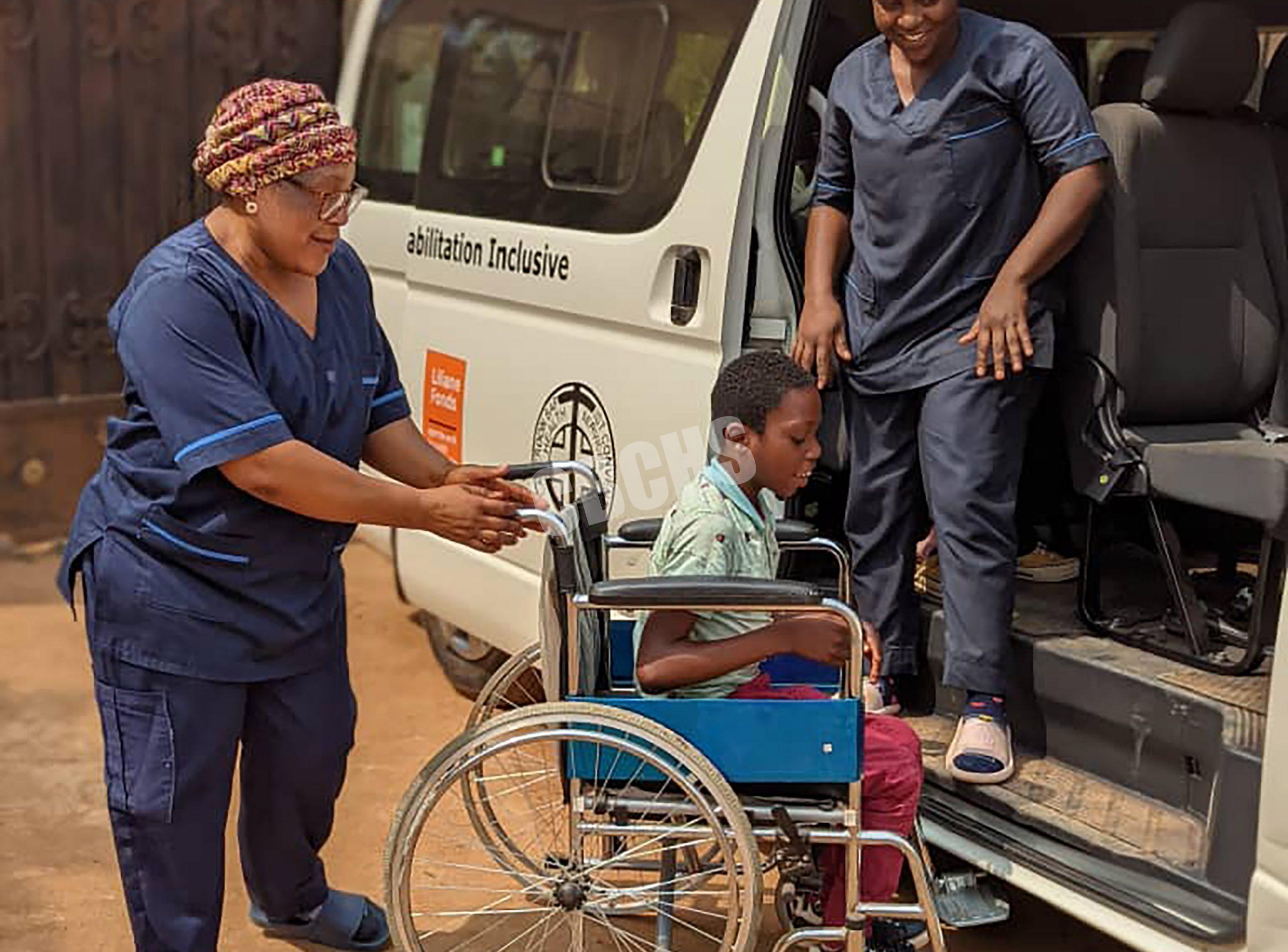 Pupil with disability being assisted to go to school via Inclusive Daycare bus