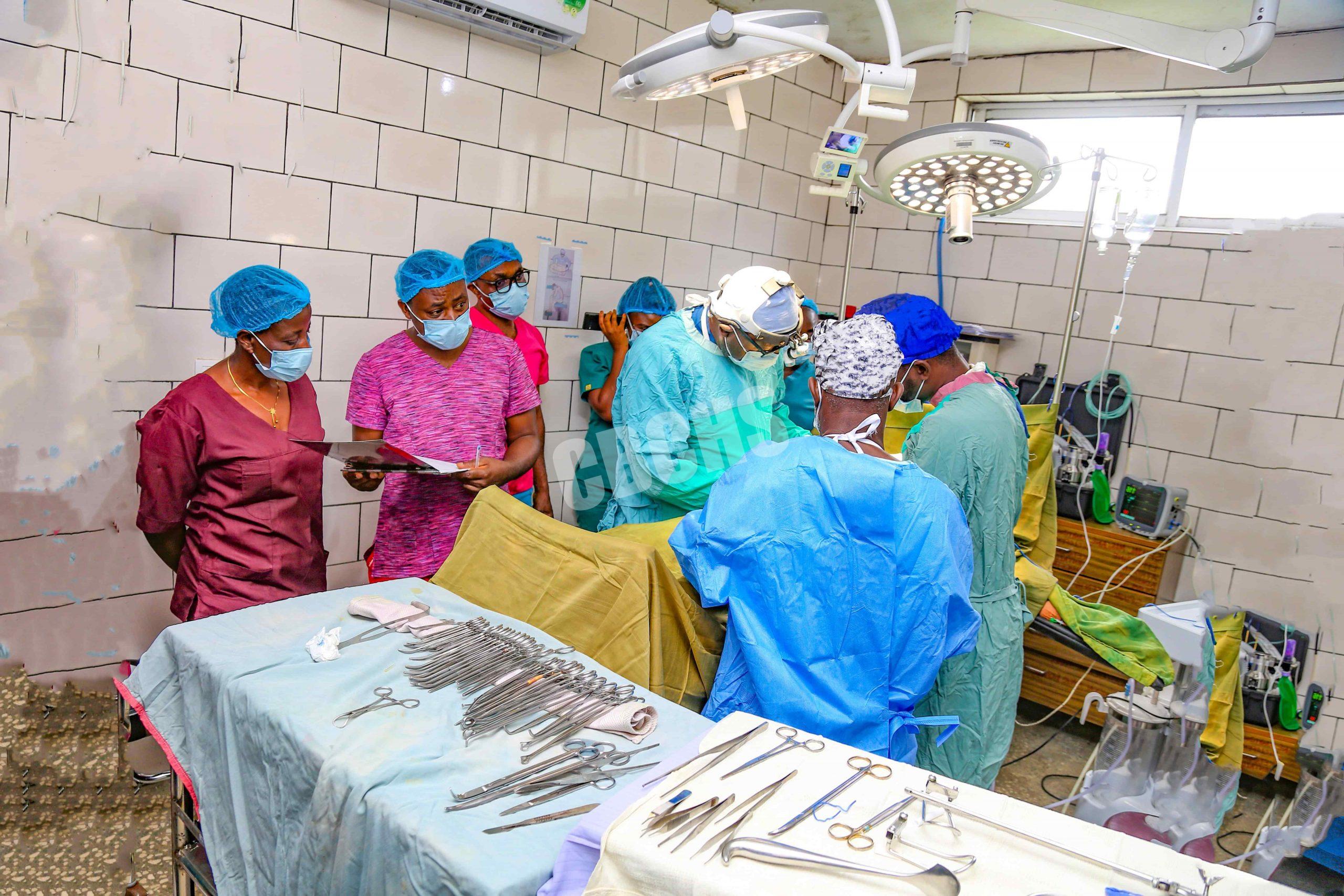 Dr Ngock and team concerntrating on a patient during surgery
