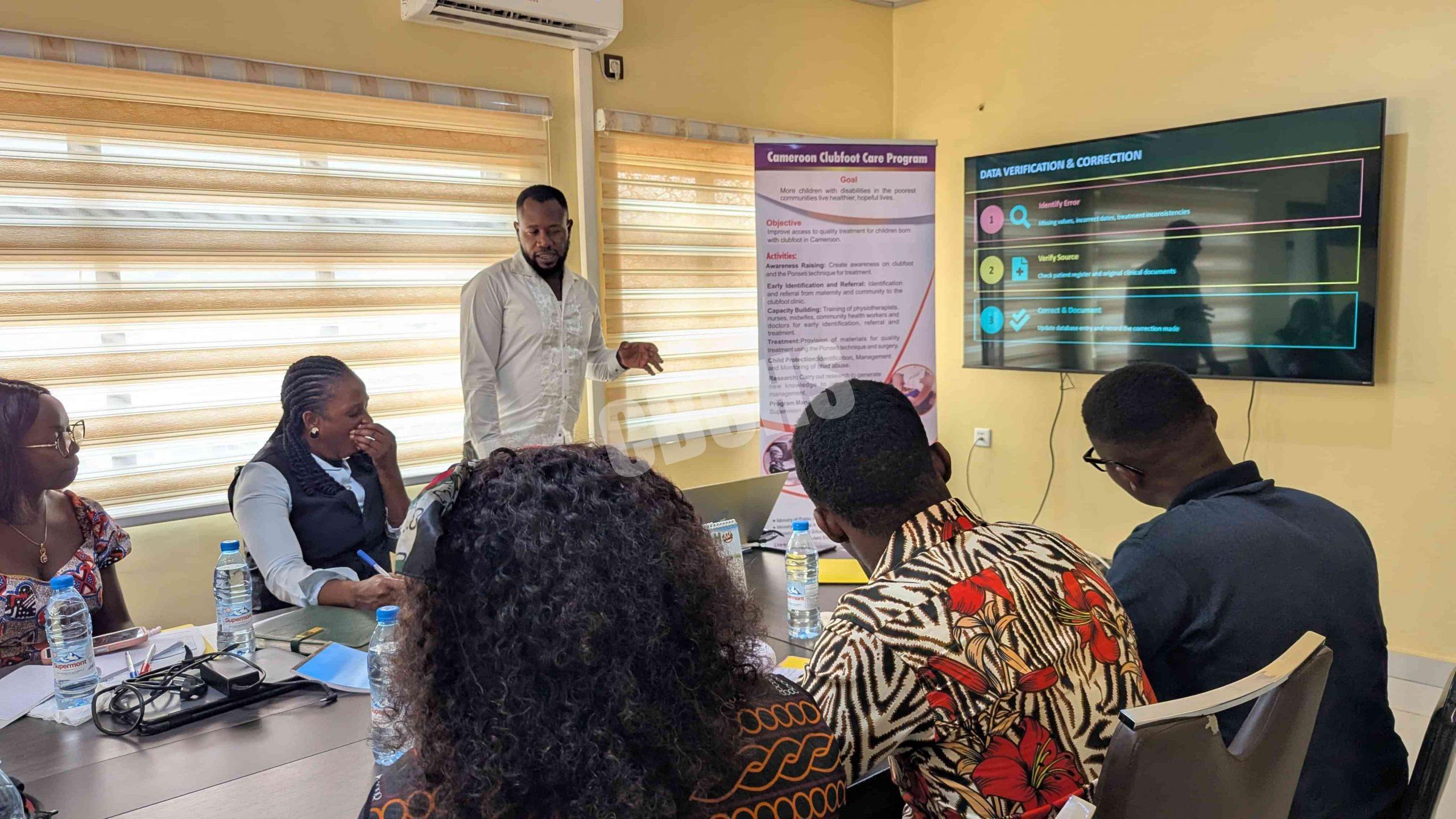 M&E Officer presenting on roles of focal points