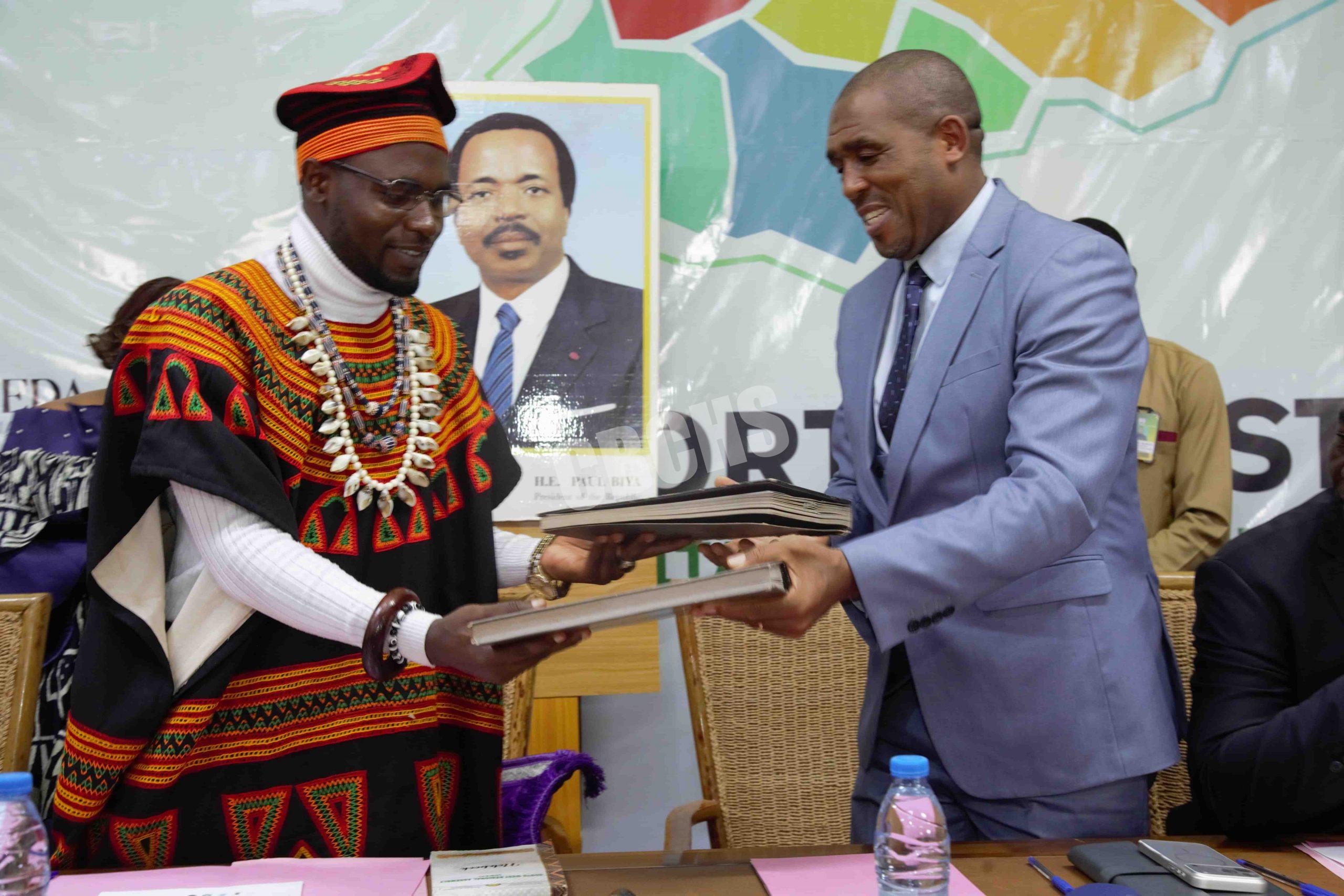 HRM Nfor Amidu & Mr. Ngum Samuel exchanging signed MoU