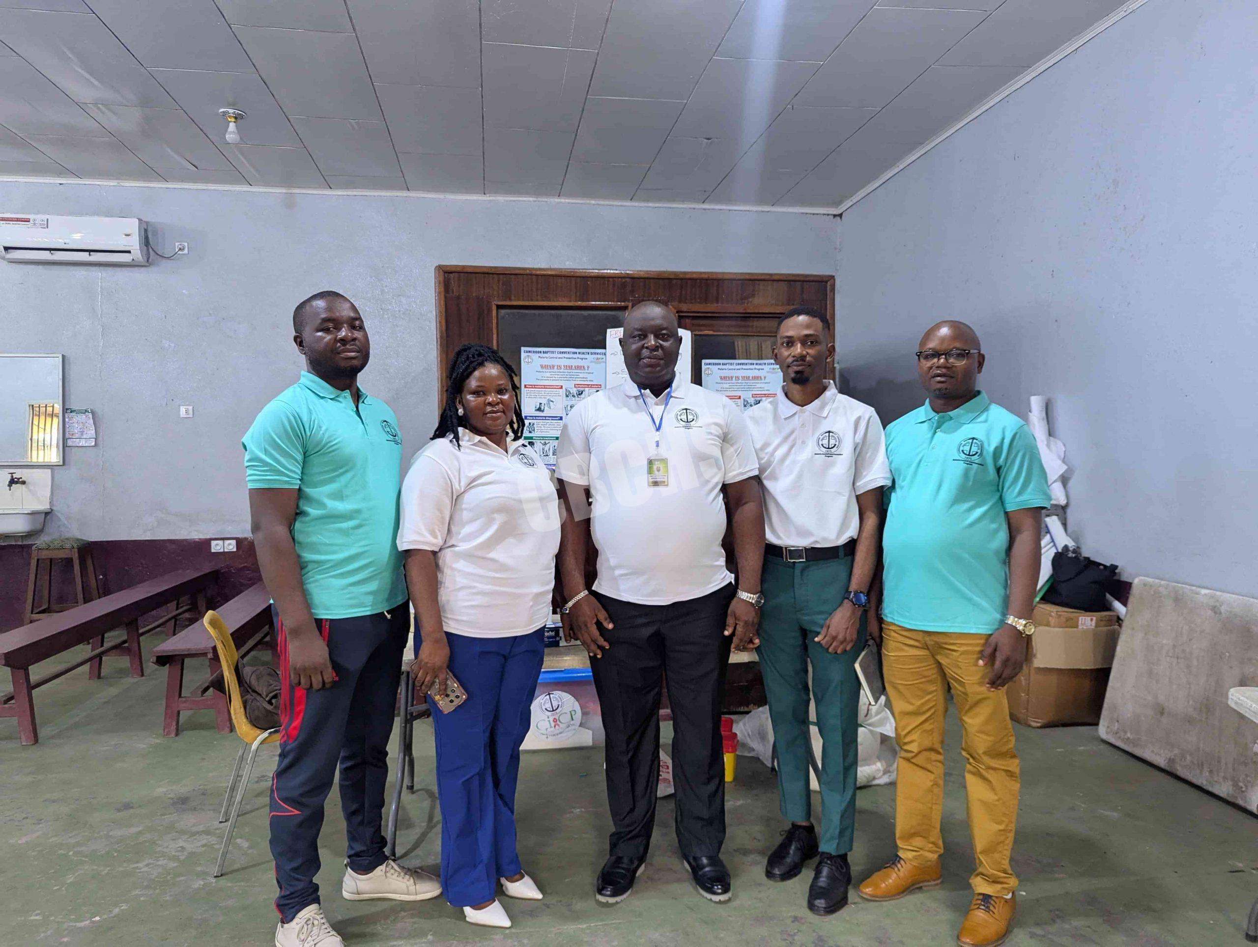 Malaria focal persons pose with HSC Mutengene Administrators