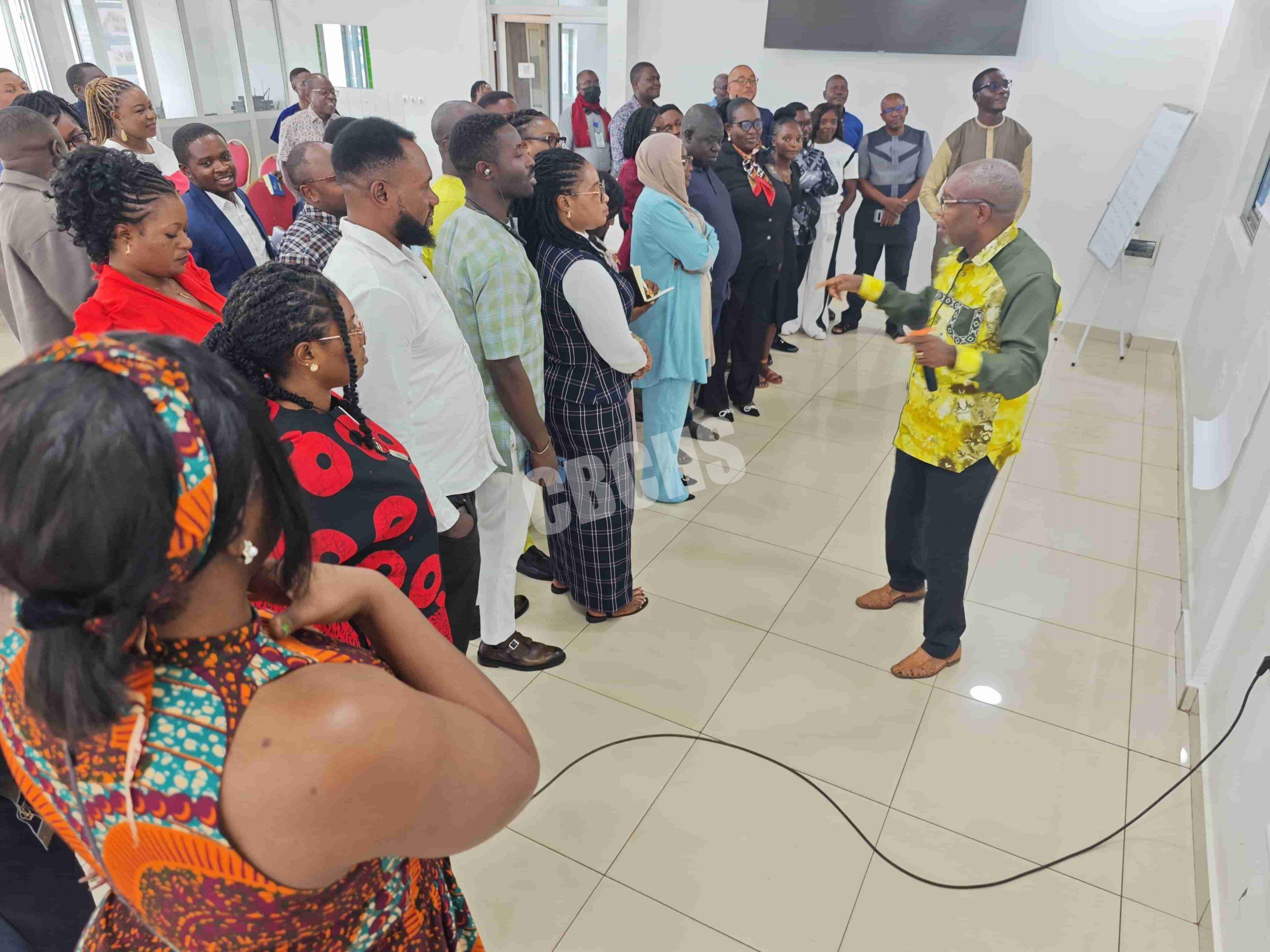 Mr. Mue drilling staff on team building in the workplace