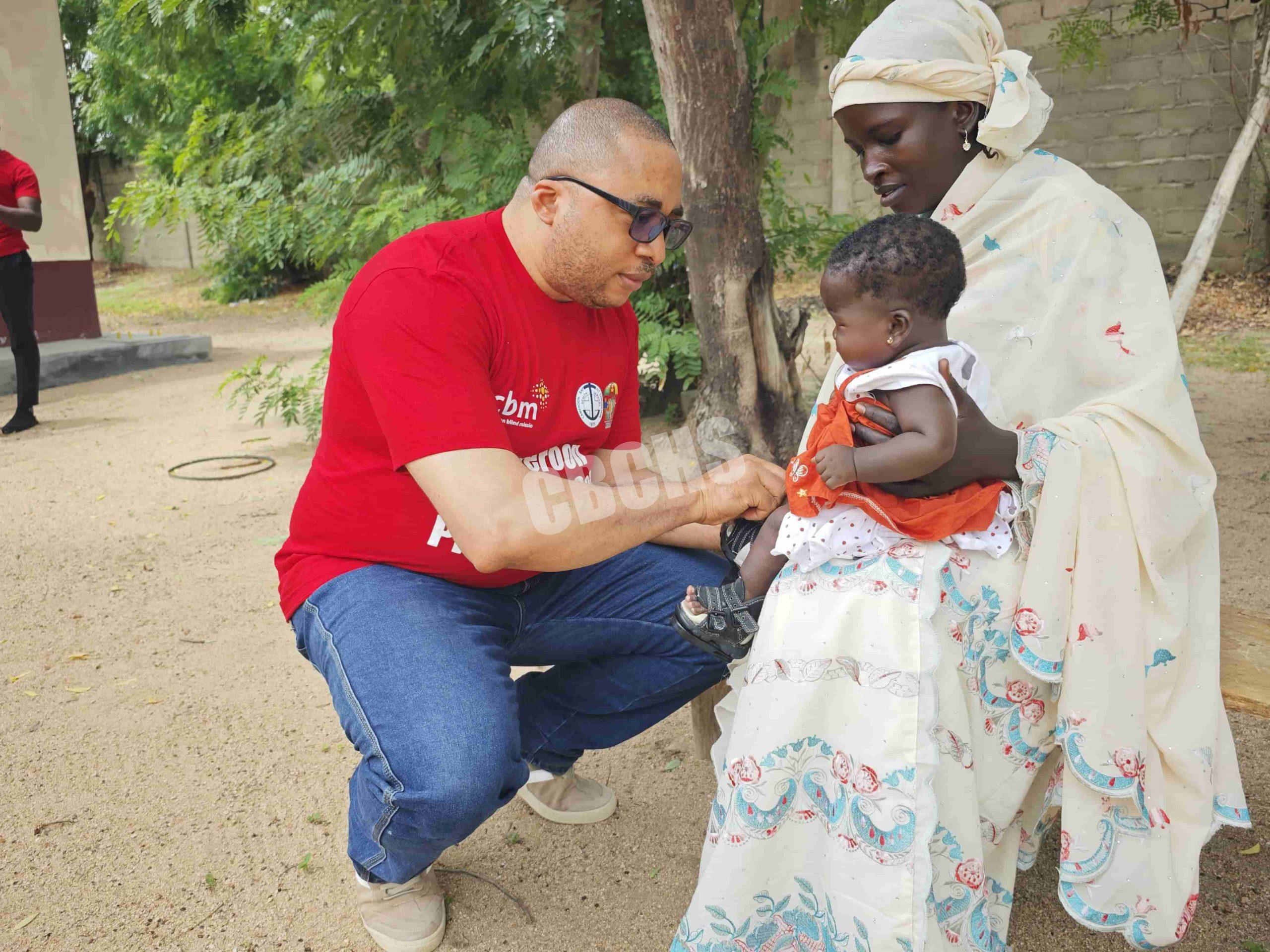 SEEPD Project Manager visiting a child receiving clubfoot treatment