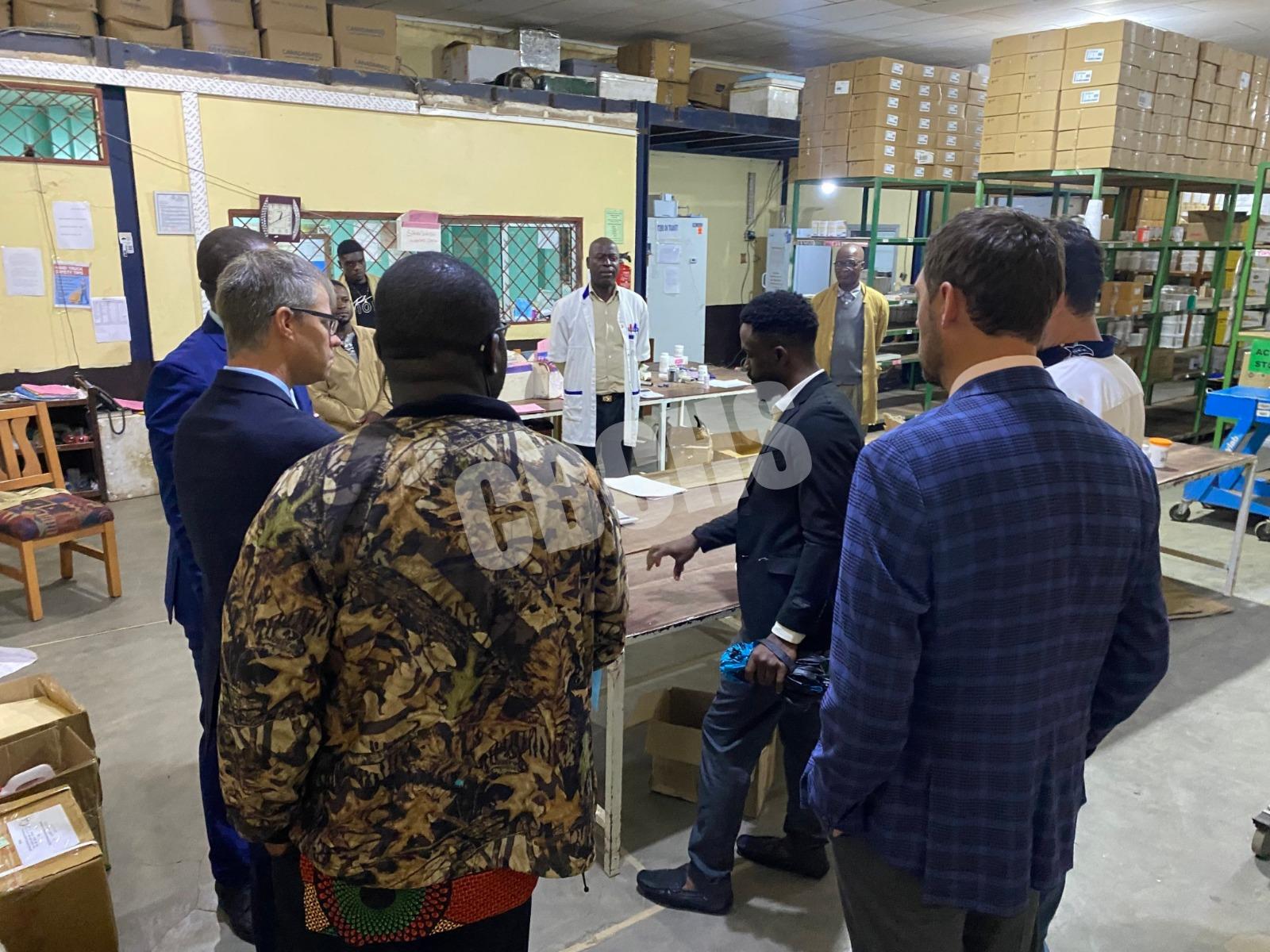 The COSECSA–PAACS team receiving briefing during a tour of the Health Service Complex, Medical Stores